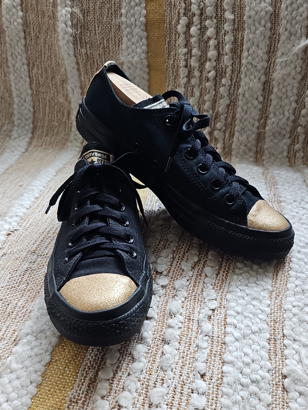 Converse Women’s Black Low-Top Sneakers with Gold Toe Caps